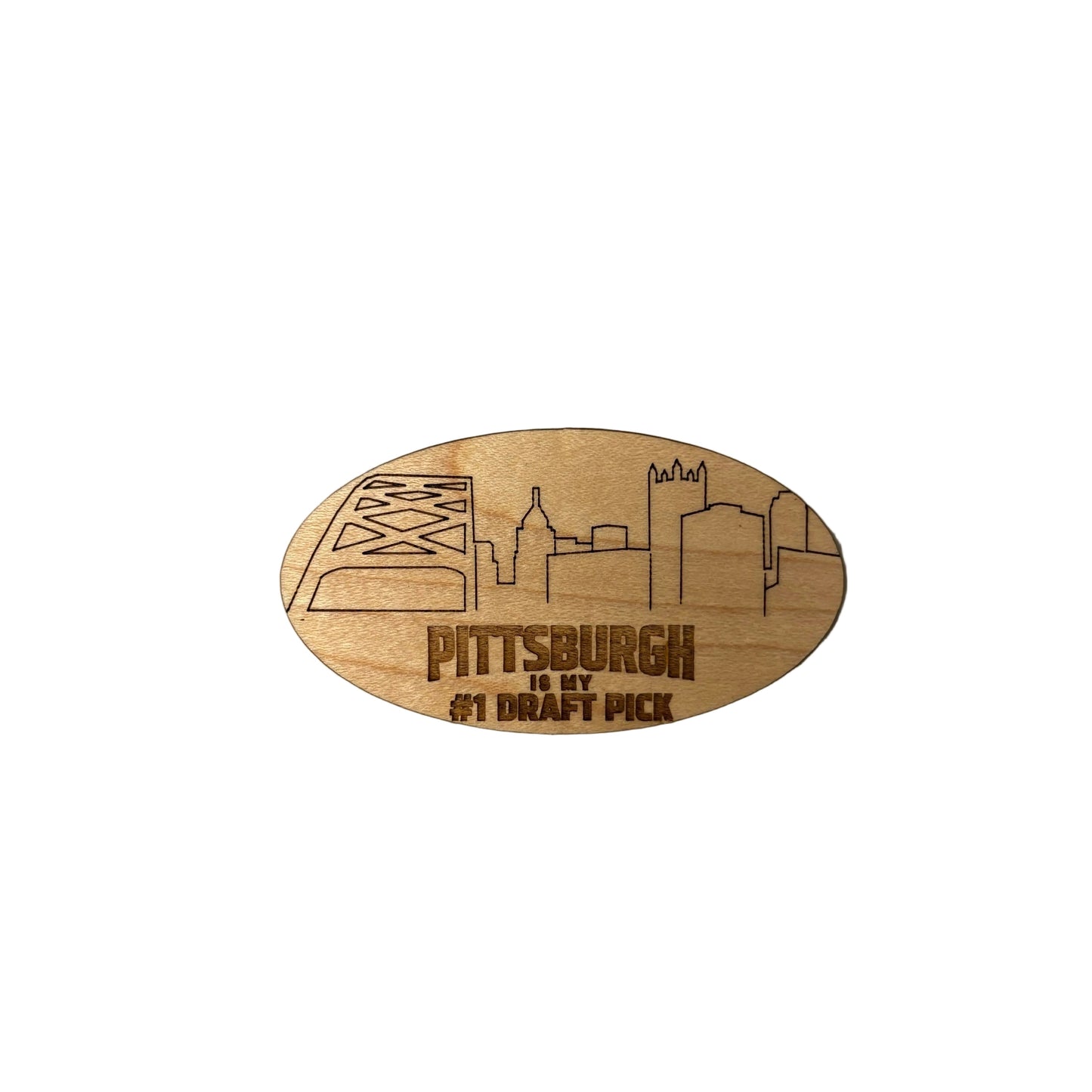 Wooden magnet with Pittsburgh skyline design on a metallic surface