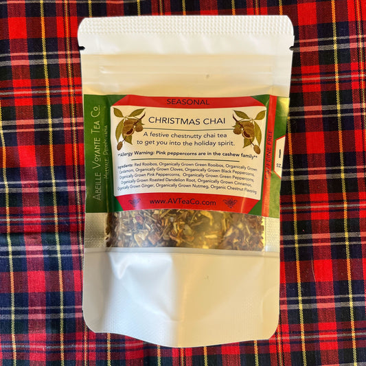 Packaged Christmas Chai tea on a red plaid background