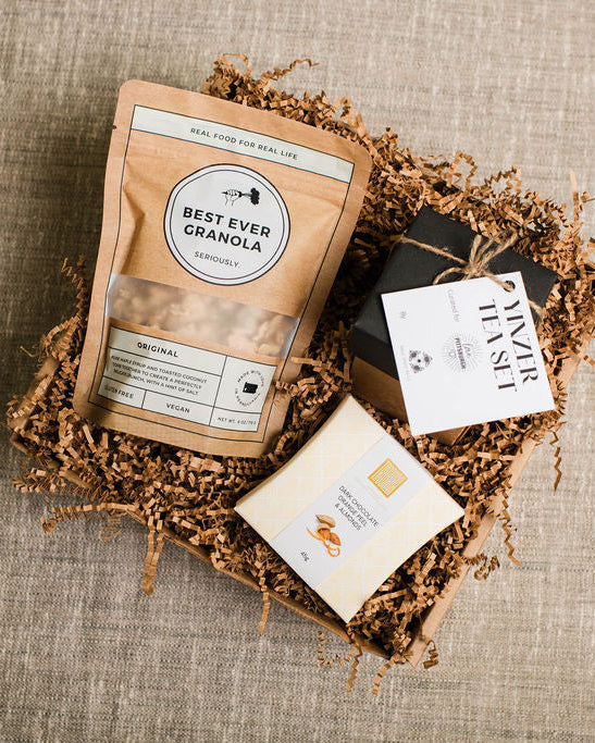 vegan gift box with granola, chocolate, and tea