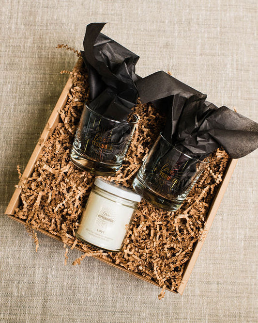 gift box with two rocks glasses and love candle