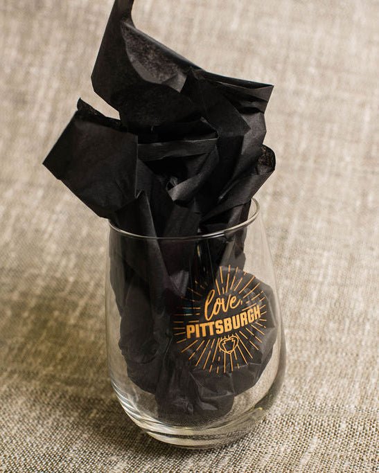 clear wine glass with black tissue