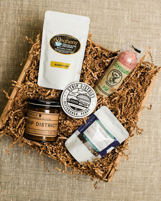 Collection of goodies made and representing the  in a decorative box on a textured surface