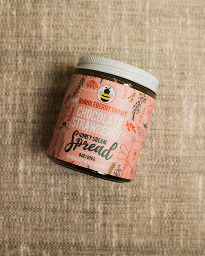 chocolate strawberry honey cream spread in a glass jar