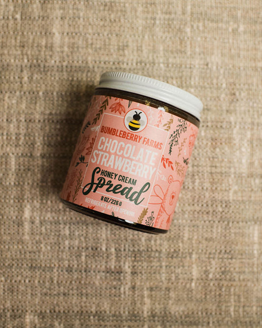 chocolate strawberry honey cream spread in a glass jar
