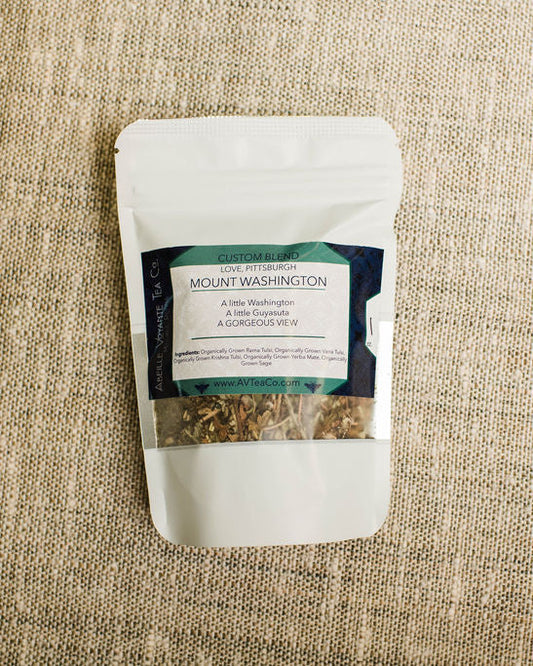 mount washington tea blend with a label on a textured beige fabric background
