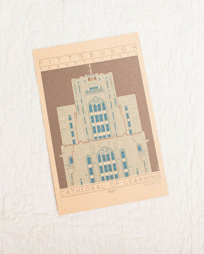 Postcard with cathedral of learning design on a textured surface