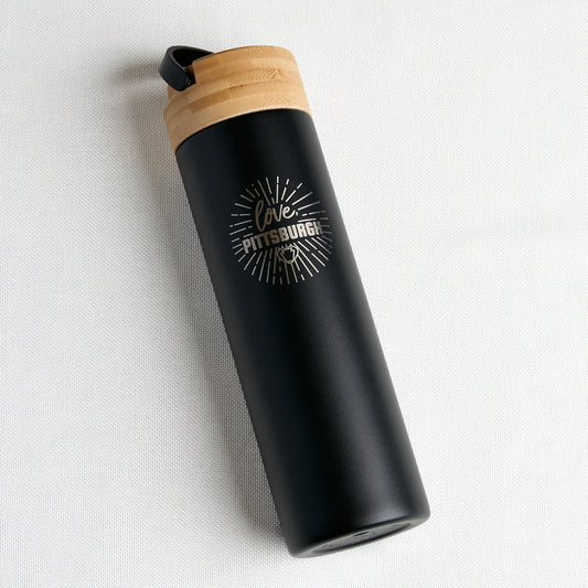 black traveler water bottle with bamboo lid and gold print "love, pittsburgh" logo