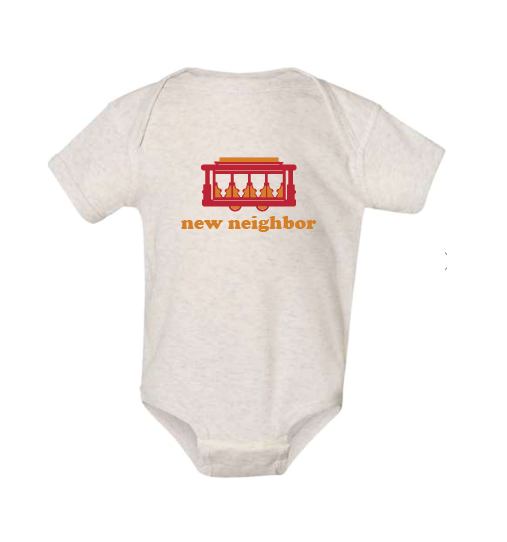 Oatmeal colored baby onesie with a red and yellow graphic and text on a white background. Featuring a red and yellow trolley with "new neighbor" underneath. 